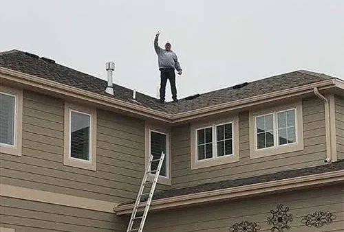 Homestead working on top of a roof during a project